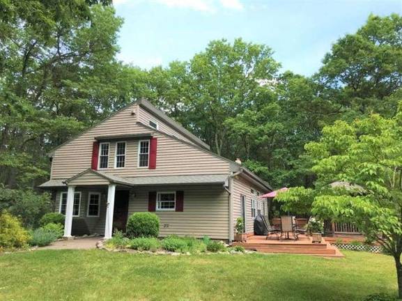 Enjoy woods and water in this two-story country farmhouse