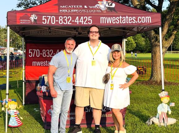 Alex McAteer, Carl Will, and Lisa McAteer at last year’s fireworks event.
