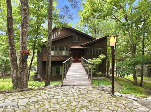 Lakefront luxury with private dock on one-plus acre