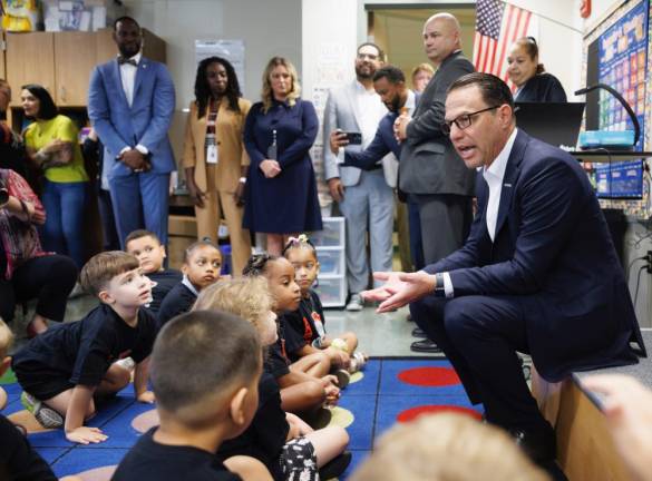 Gov. Josh Shapiro talks with young people at the Millmont Elementary School in Reading during a ceremonial signing of the 2023-24 budget bill to provide universal free breakfast to nearly 1.7 million Pennsylvania public school students across the Commonwealth on Aug. 11. Provided photo.
