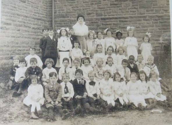 An early class supposed to have gone to the Schocopee School (Photo by Ginny Privitar)