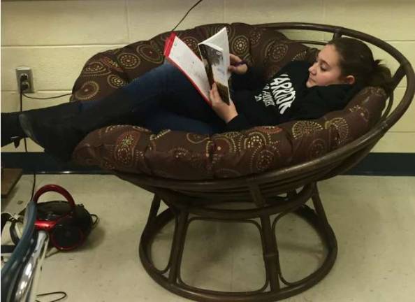 Haylee Mosser enjoys her reading adventure in the "incentive chair" (Photo provided)