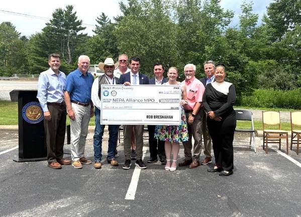 Rep. Bresnahan presents a check for $2 million in federal funding for State Route 6 repairs.