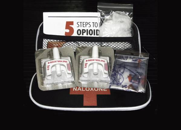 Naloxone nasal delivery method of Narcan distributed by healthcare professionals to help combat opioid crisis and reverse the effects of opioid overdose.