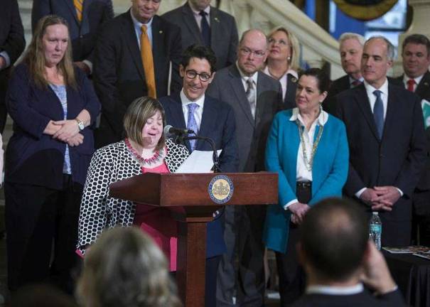 Sara Wolff of Moscow. Pa., and National Down Syndrome Society (NDSS) board member, addressed those gathered in Harrisburg at the launch of the Achieving a Better Life Experience, or ABLE, savings accounts. The first one in the state was assigned to her. Among those looking on are state Sen. Lisa Baker, U.S. Sen. Bob Casey Jr. and state Treasurer Joe Torsella. (Photo provided)