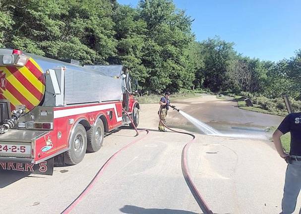 Firefighters from Bushkill Volunteer Fire Company, Station 24, help clean up after Hurricane Ida (NPS Photo/T. Roessner)