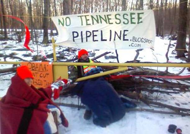 Allison Petryk of Vernon, N.J., and Alex Lotorto of Milford, Pa.,dug in the end of Schocopee Road throughout the work day Tuesday to prevent access by pipeline tree clearing crews.