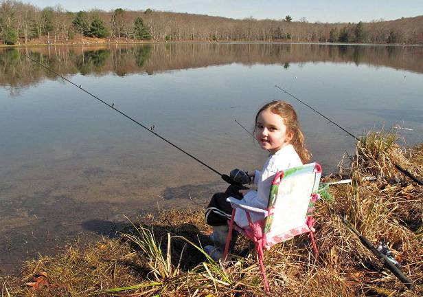 Samantha Stead, 5, relaxes in her easy chair, just fishing away. &quot;I got a small one last year,&quot; she said.