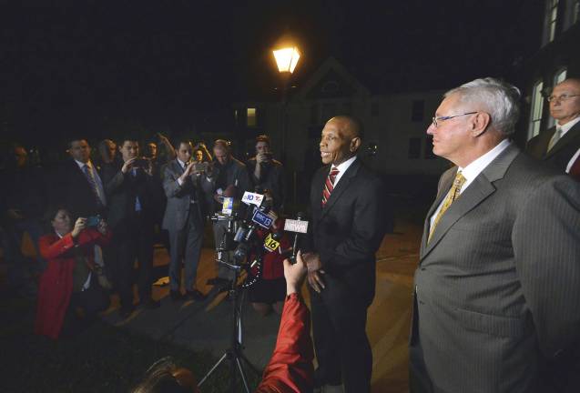 Pennsylvania State Police Commissioner Col. Tyree Blocker talks with reporters after cop killer Eric Frein was sentenced to death late Wednesday, April 26, 2017, at the Pike County Courthouse in Milford, Pa.. Standing at right is former Pennsylvania State Police Commissioner Frank Noonan. (Butch Comegys/The Times &amp; Tribune via AP)