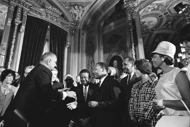 Source: Library of Congress President Lyndon B. Johnson accepts the hand of Dr. Martin Luther King Jr. following the president's signing of the Voting Rights Act of 1965.