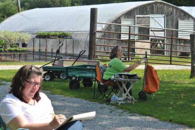 Lisa Peet and Lori Gearhart chose a spot at the back of the old, converted barn that's now a garden center for painting.