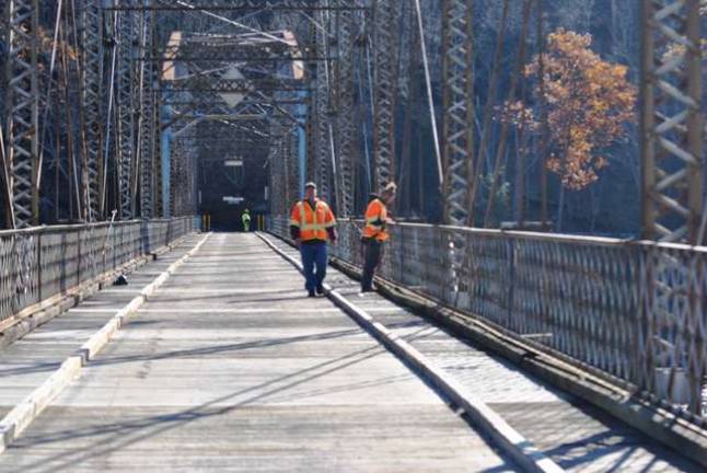PennDOT inspectors on the Pond Eddy Bridge, which since the 1990s has been deemed too hazardous for school buses and firetrucks (Photo by Anya Tikka)