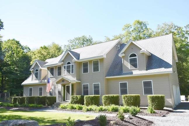 Upscale four-bedroom colonial has lake access