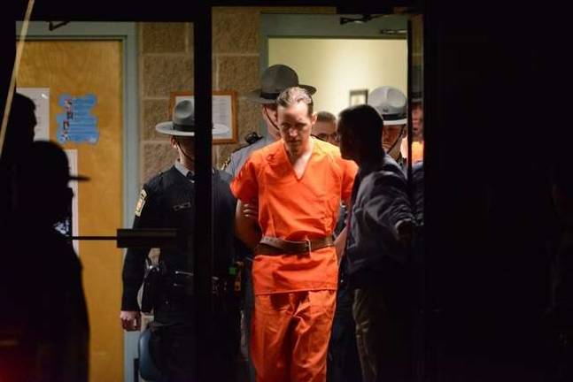State troopers escort Eric Matthew Frein from the Blooming Grove barracks on Oct. 31, 2014 (AP Photo)