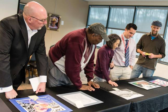 The judges of the Julianna V. Bolt Art Contest (from left): Pat Lincoln, general manager of Connoisseur Media; Wayne Bolt, husband of the late Julianna V. Bolt; Joni Oye-Benintende, associate professor of art and design; Brandon Abbazio, community relations specialist at PMC; and David Mazure, associate professor of art and design. (Photo provided)