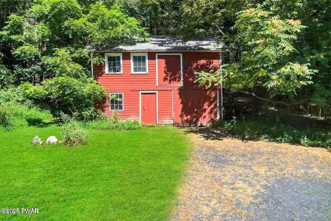 Updated farmhouse offers character, privacy and a walkable lane to town