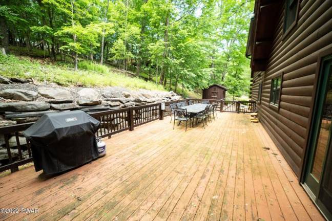 Furnished, spacious log and stone cabin is move-in ready
