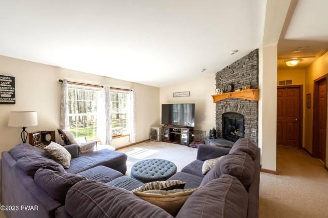 Ranch offers one-level living with extra space and lake access