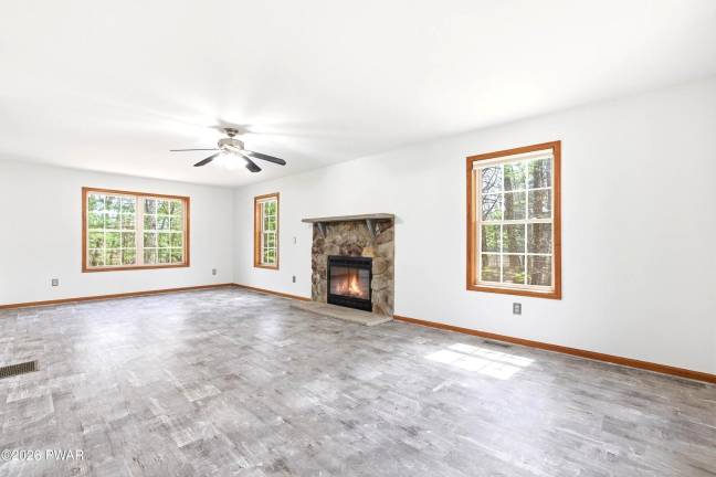 Modern four-bedroom home is move-in ready on a treed acre