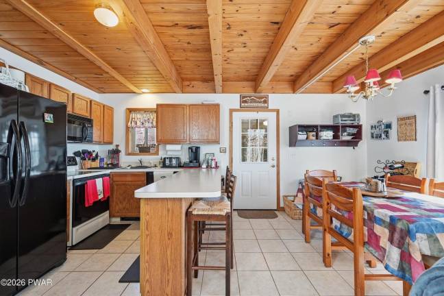 Tri-level modern lakefront comes with panoramic views and dock