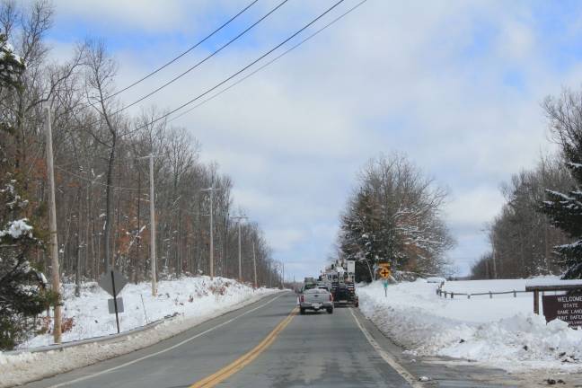 Several dozen big utility trucks lined Route 6 on Monday morning, about 11 miles outside of Milford (Photo by Pamela Chergotis)