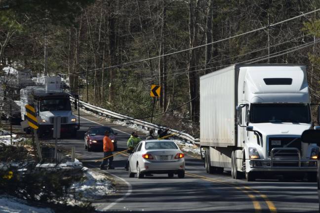 Photo by Erika Norton A truck got stuck under a hanging power line on Milford Road Tuesday.