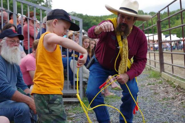 Photos by George LeRoy Hunter Cowboy Larry with a young rodeo fan.