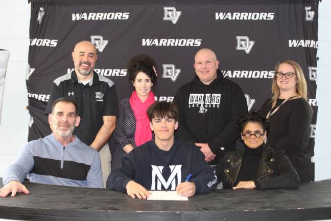 Delaware Valley High School senior Brady Quinn sits with his parents, James and Deirdre Quinn and (standing l-r) assistant lacrosse coach Dan Gonzalez, principal Dr. Nicole Cosentino, head lacrosse coach Jeff Krasulski and guidance counselor Jess Favorito.