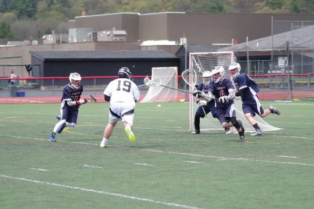 Delaware Valley's Riley Vanwie (19) moves the ball towards the goal post as Liberty defends. Vanwie scored two goals.