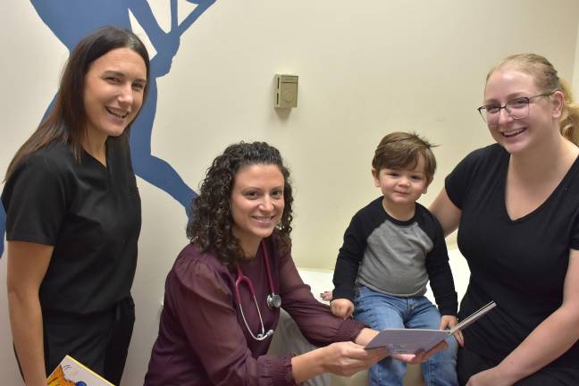 Amy Cellar and Dr. Veronica Cellini with 2-year-old Russell Veleze, and his mom, Charity-Beth Veleze, of Lake Ariel.