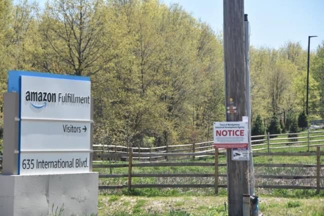 One of two entrances to the new Amazon warehouse, where a notice is posted that the project is receiving assistance from the Town of Montgomery Industrial Development Agency.