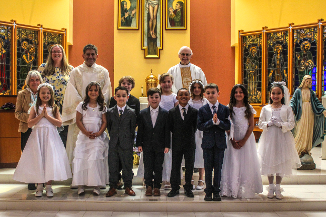 Eleven area children received the Sacrament of Holy Communion recently at the Church of Saint Patrick.