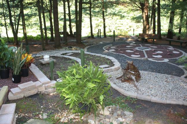 Photos by Linda Fields The prayer and meditation grove features benches for prayer circles and wheelchair-accessible inspirational paths.