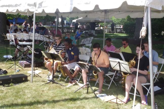 Music can be found in every corner of Milford during the festival. Pictured: The Delaware Valley High School Band performs along Harford Street at a past festival (Photo by George Leroy Hunter)