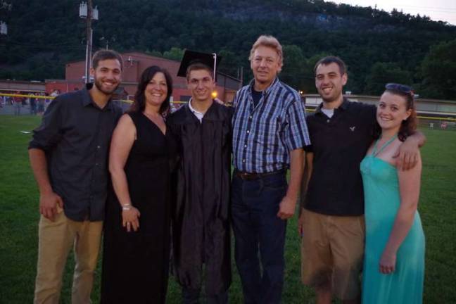 Graduate Thomas Smith with his family.