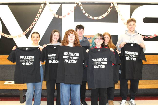 Delaware Valley High School Students of the Month pose with Warrior Nation shirts.