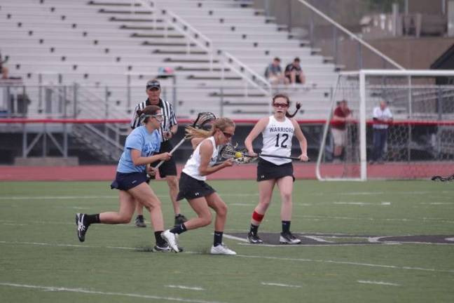 Delaware Valley's Kirsten Dunn catches the ball with her stick