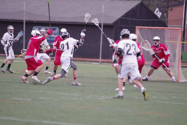 Delaware Valley Warrior Ryan Woolley (21) in throw motion during a shot attempt. Woolley contributed one assist.