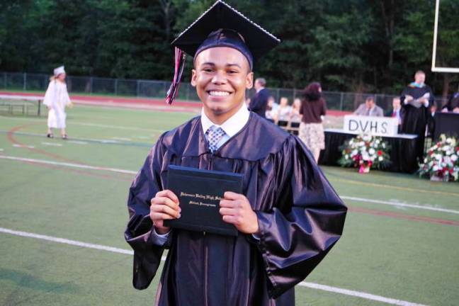 Graduate Shemar Williams is all smiles after receiving his diploma.