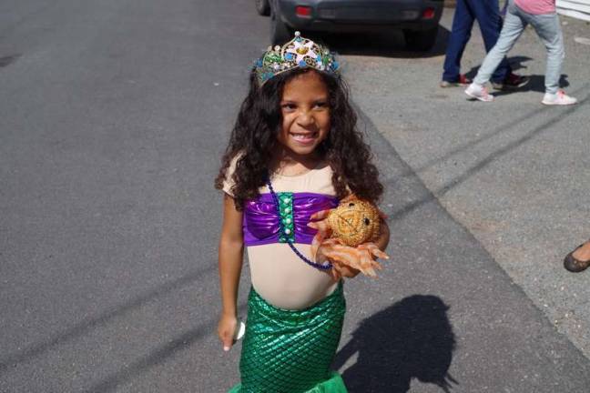 Four-year-old Makayla Lewis of Barryville, N.Y., added extra cuteness to the mermaid parade (Photo by George Leroy Hunter)