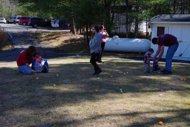Easter egg hunters gather their prey (Photo by George Leroy Hunter)