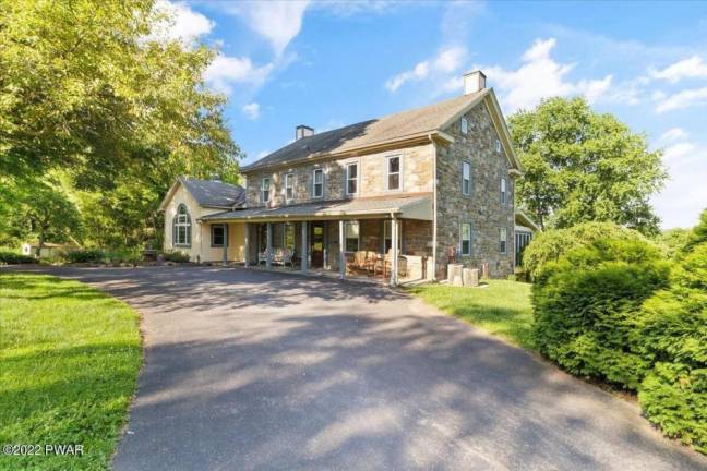 Stone farmhouse on 29+ acres with pond, pool, stables and more
