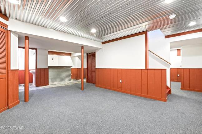 Modern four-bedroom home is move-in ready on a treed acre