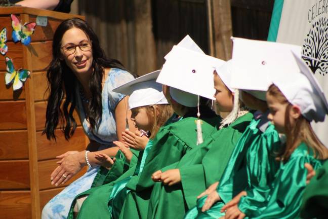 Pre-K Teacher Jen Inga with graduates.