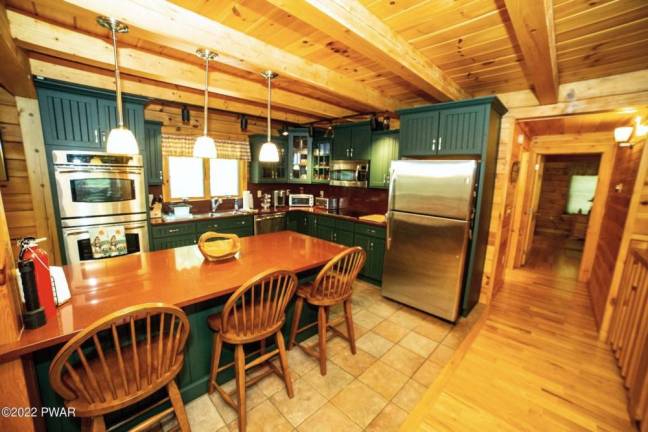 Furnished, spacious log and stone cabin is move-in ready