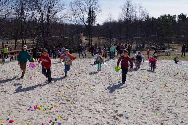 Easter egg hunters search for the egg containing the “Golden Ticket”