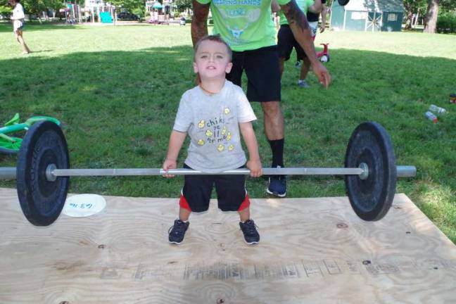 Three year old Joseph Fleming of Pike County does a dead lift.