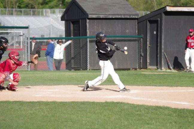 Delaware Valley batter Ryan Simpson connects with the ball.