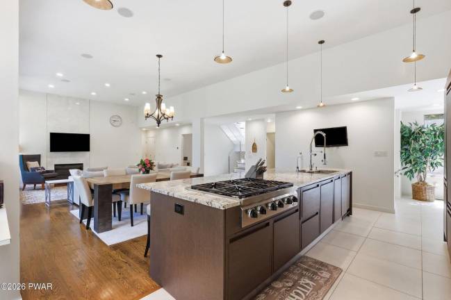 Upscale modern lakefront has private dock, media room and home gym