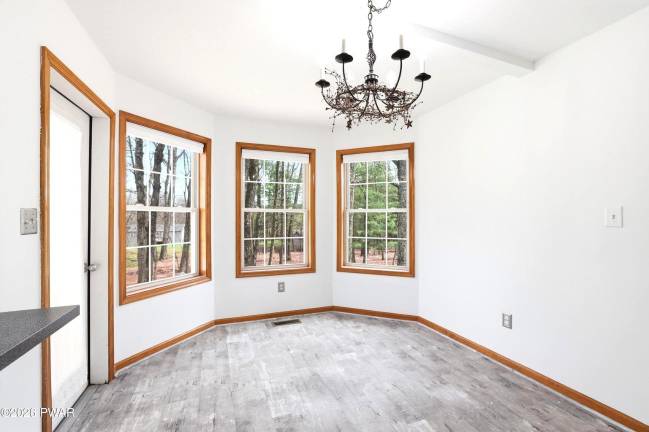 Modern four-bedroom home is move-in ready on a treed acre